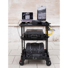 SCHLEPP ONE Camera Cart - lightest Camera Carts in the World. Optional Middle Shelf can be stored inside the cart. 60mm walls (lips) on the top shelf and base shelf protect your gear. Add countless first- and third-party accessories like the Espresso 17" Pro Display for your work on set. Lighter than any Magliner or other production / camera cart, SCHLEPP ONE was designed for single-person use